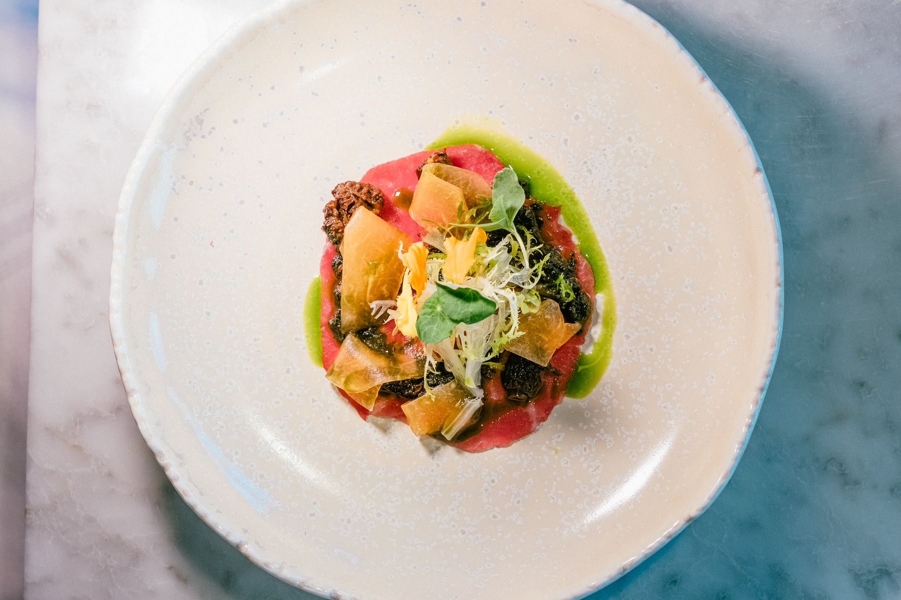 Single fine dining plate with artistic garnish