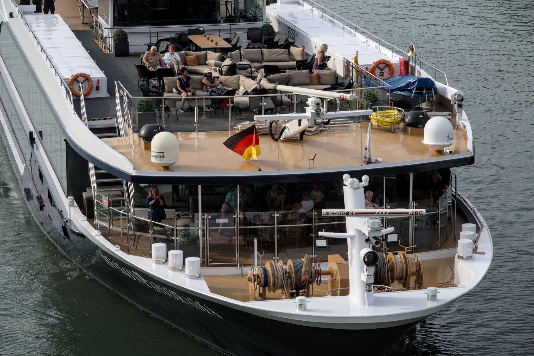 Travelers relaxing on the deck of a European river cruise ship